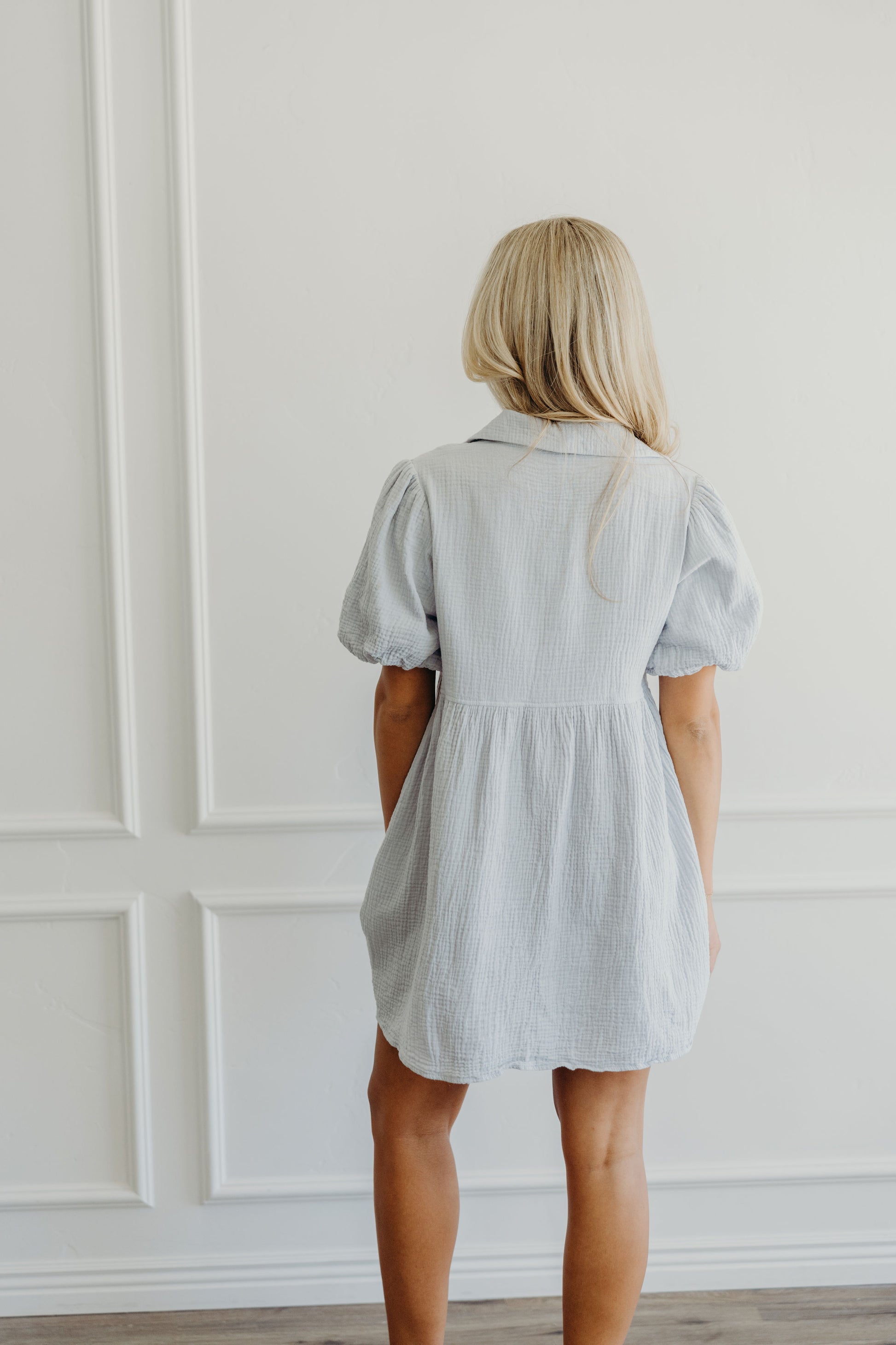 Back of short textured dress with collar detail. 